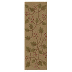 Stickley wool runner rug with green leaves and red berries on a beige background.