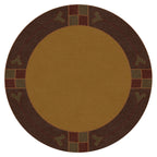 Round Paradise Valley Stickley wool rug in gold and brown with geometric border.