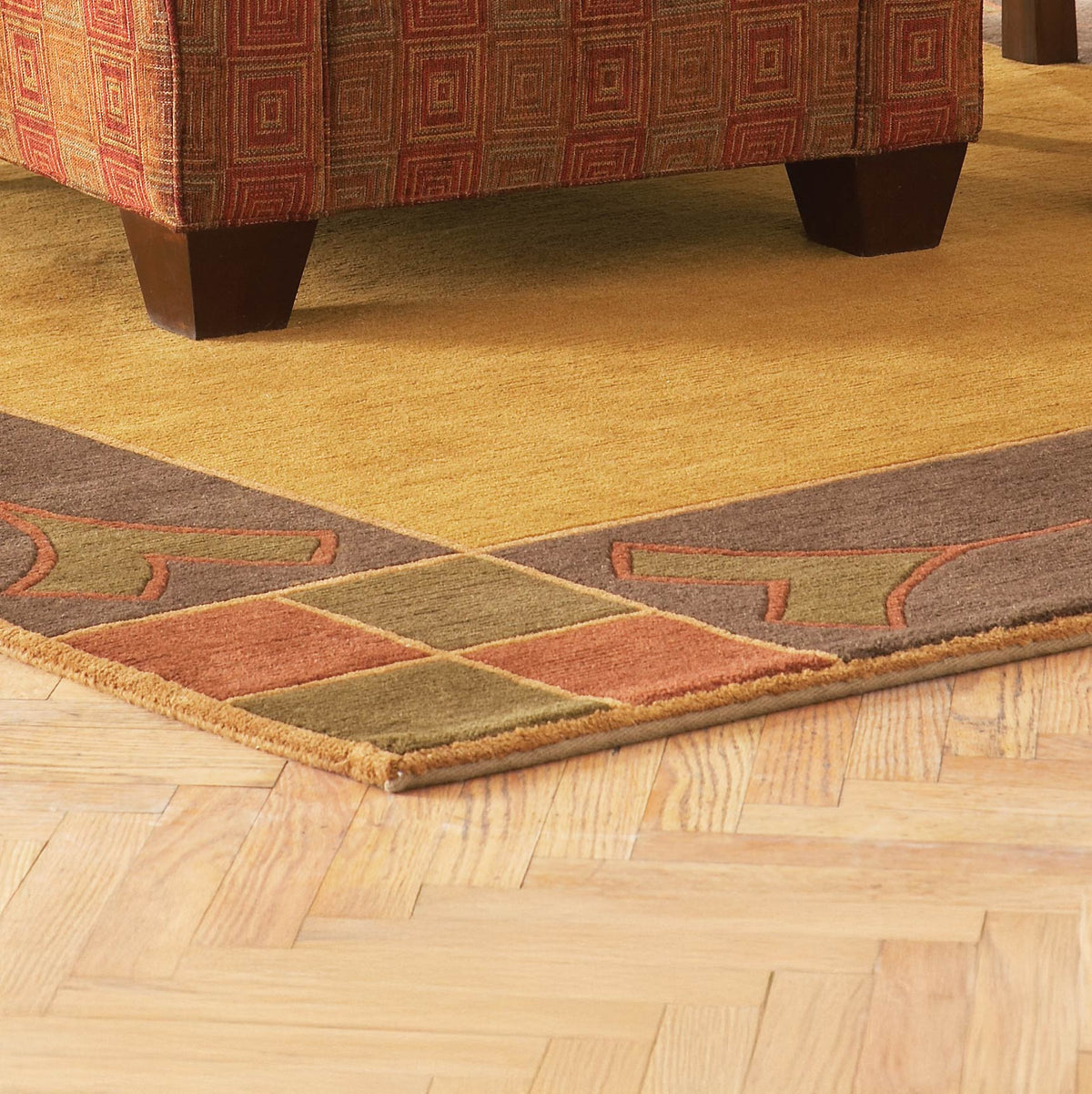 Paradise Valley Stickley wool rug in gold, brown, and rust with geometric borders