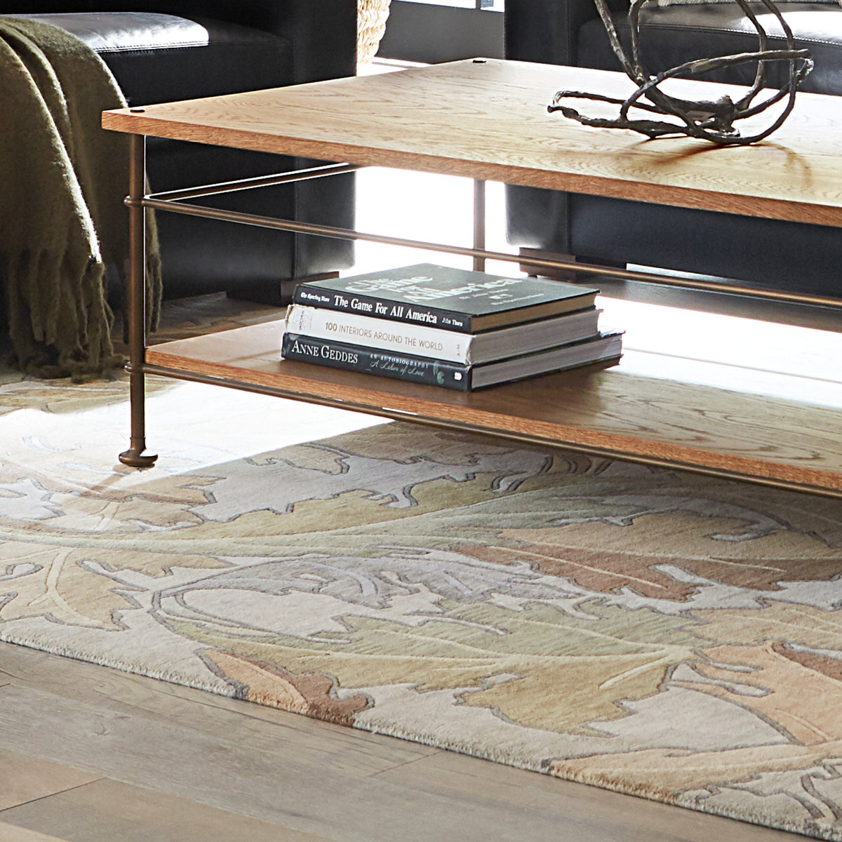 William Morris Acanthus wool rug with botanical leaf patterns under a wooden coffee table