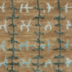 Whipstitch Stickley wool rug with a tan background and green and blue bamboo silk plaid pattern.