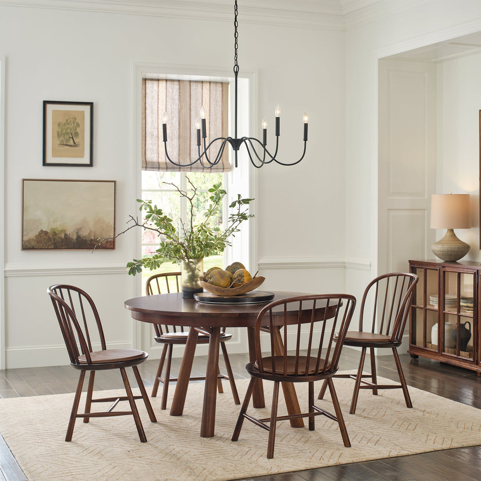 Line Dance Stickley wool rug with copper lines under a wooden dining set.