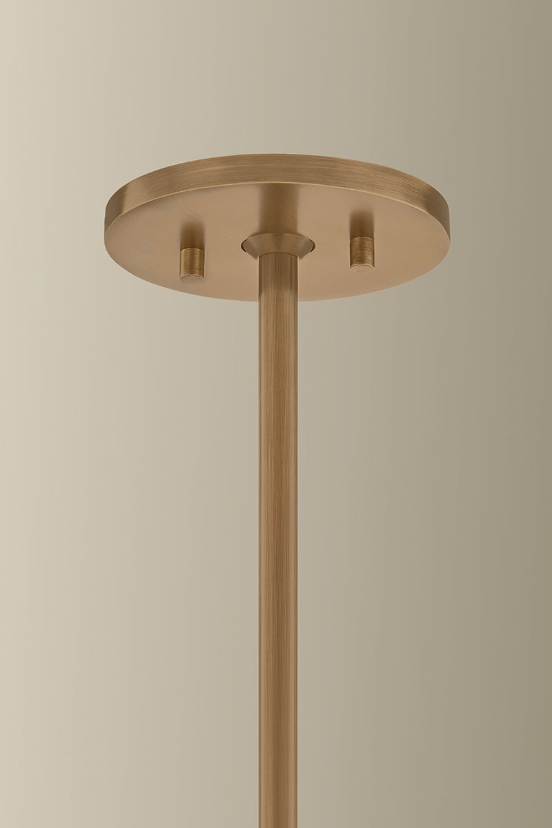 Patina Brass ceiling canopy and downrod of the Stoney Chandelier.