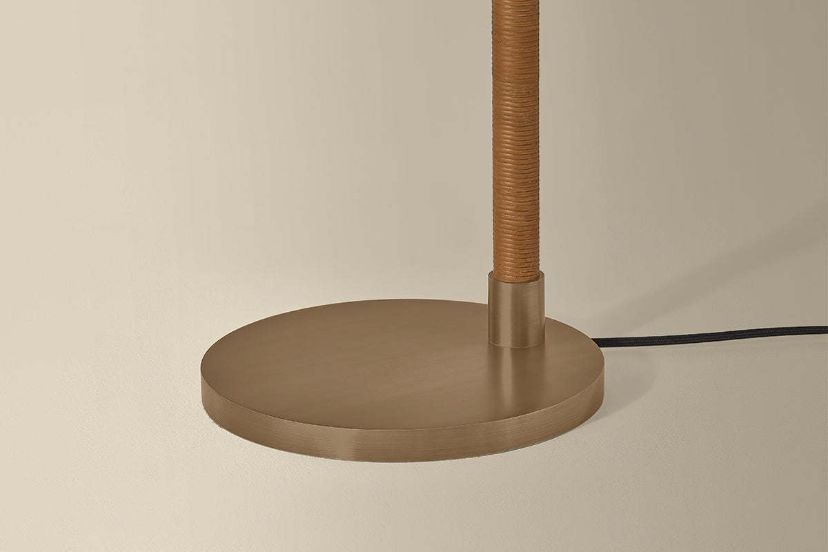 Stoney floor lamp patina brass base with natural jute wrapped stem.