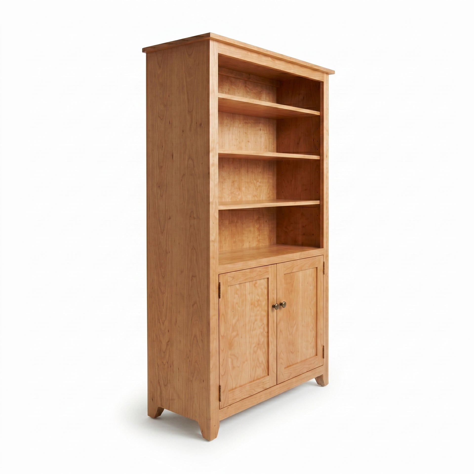 Simple Shaker cherry wood bookcase with three open shelves and a double-door bottom cabinet.