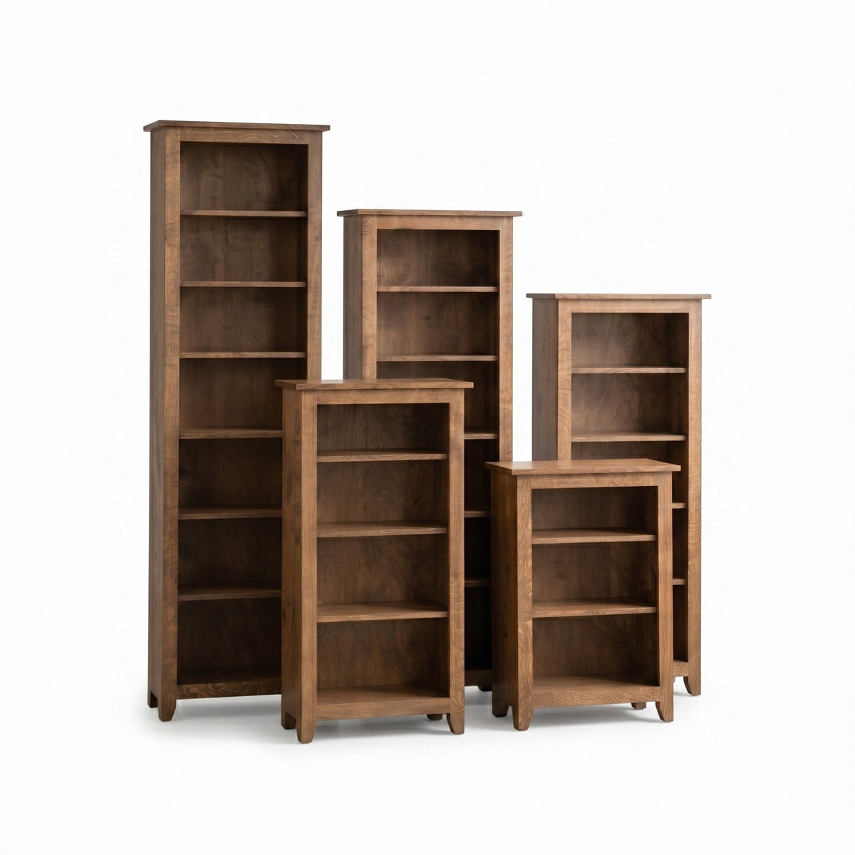 Five Simple Shaker wooden bookcases in varying heights with a warm brown finish.