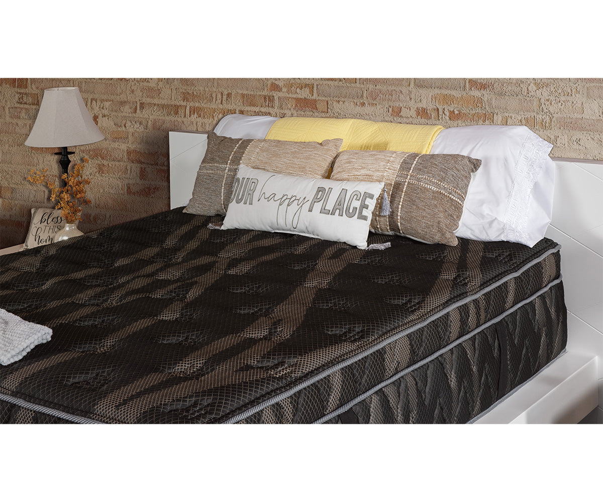 Astra Luxe Euro-top mattress with dark patterned fabric on a white bed frame.