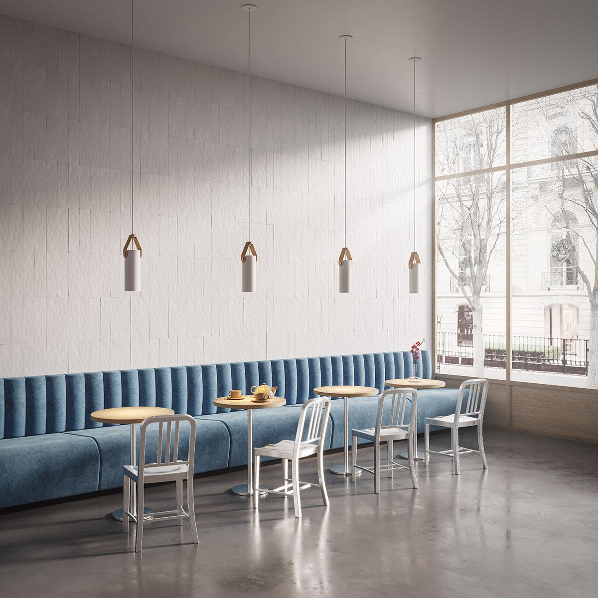 Four Spero minimalist pendant lights hanging above cafe seating.