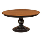 St Charles round wooden dining table with a brown oak top and black pedestal base.