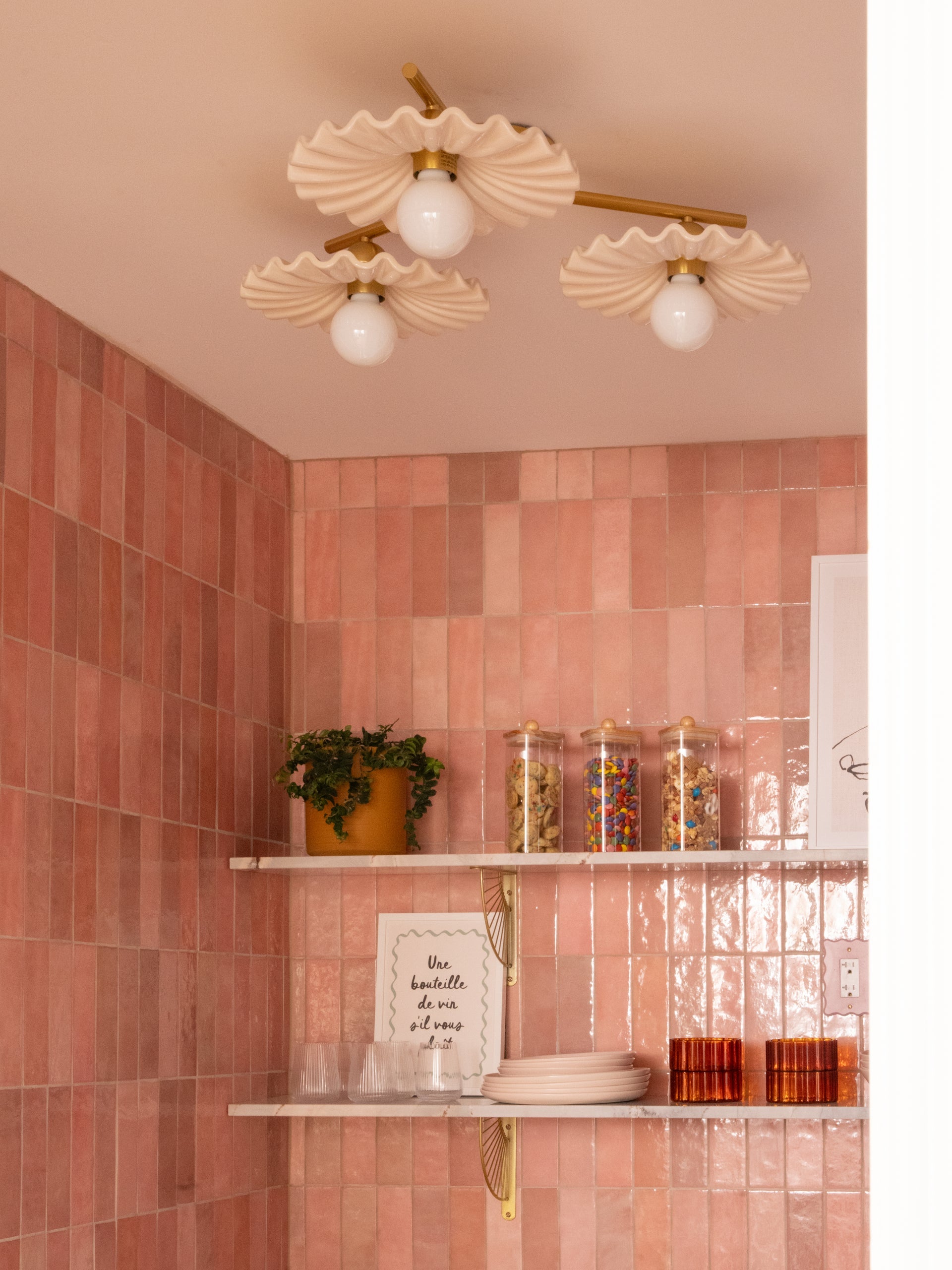Tinsley semi-flush ceiling light with three white ruffled ceramic shades and aged brass pipes.