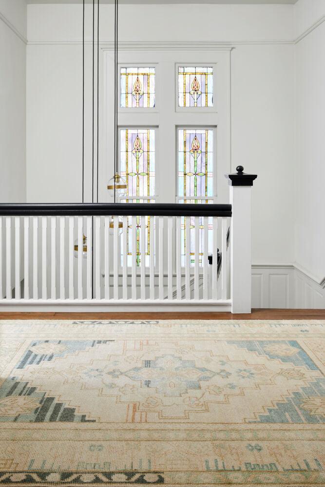 Anadolu hand-knotted wool and viscose rug with a traditional cream and blue pattern