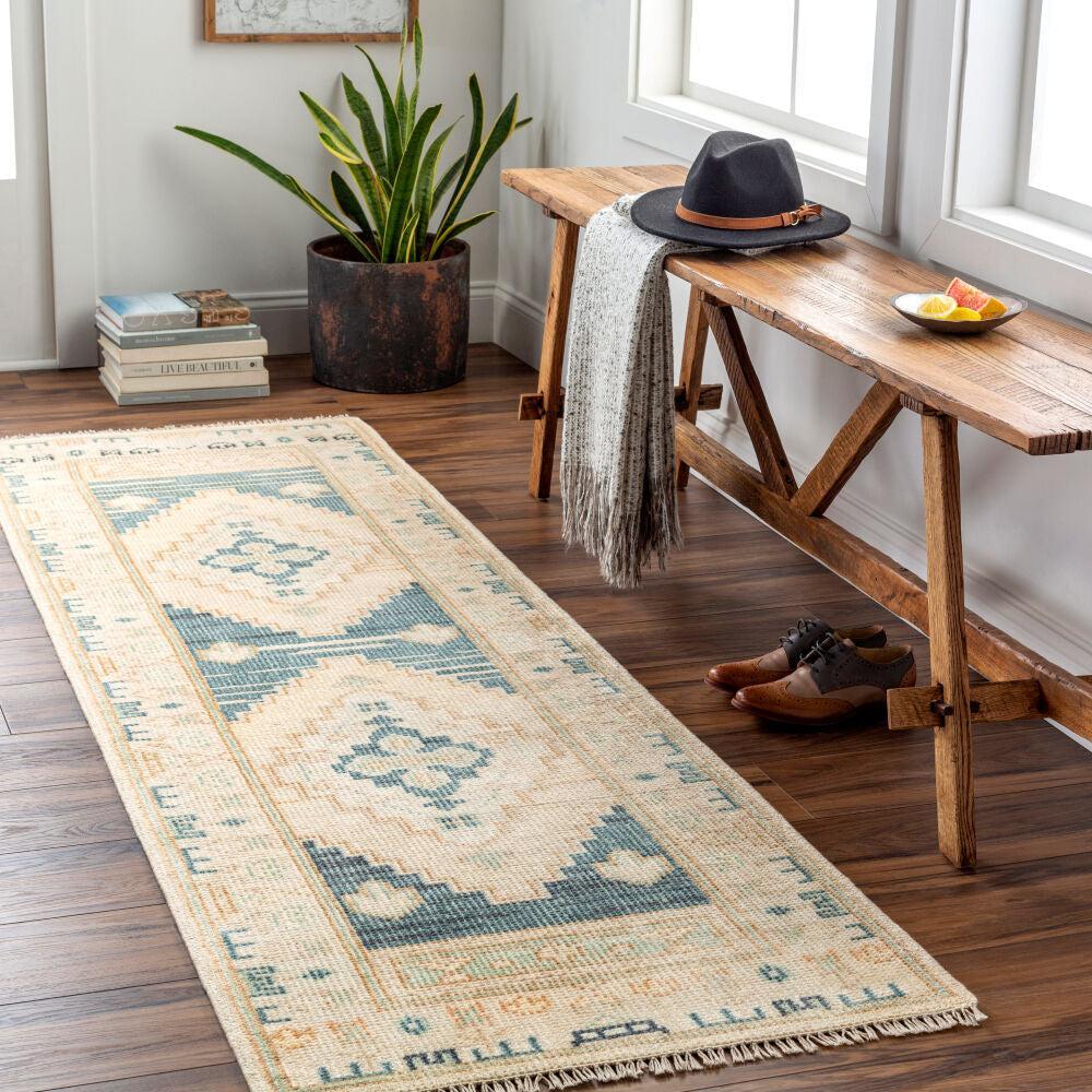 Anadolu hand-knotted wool runner rug with blue and beige traditional patterns on wood floor