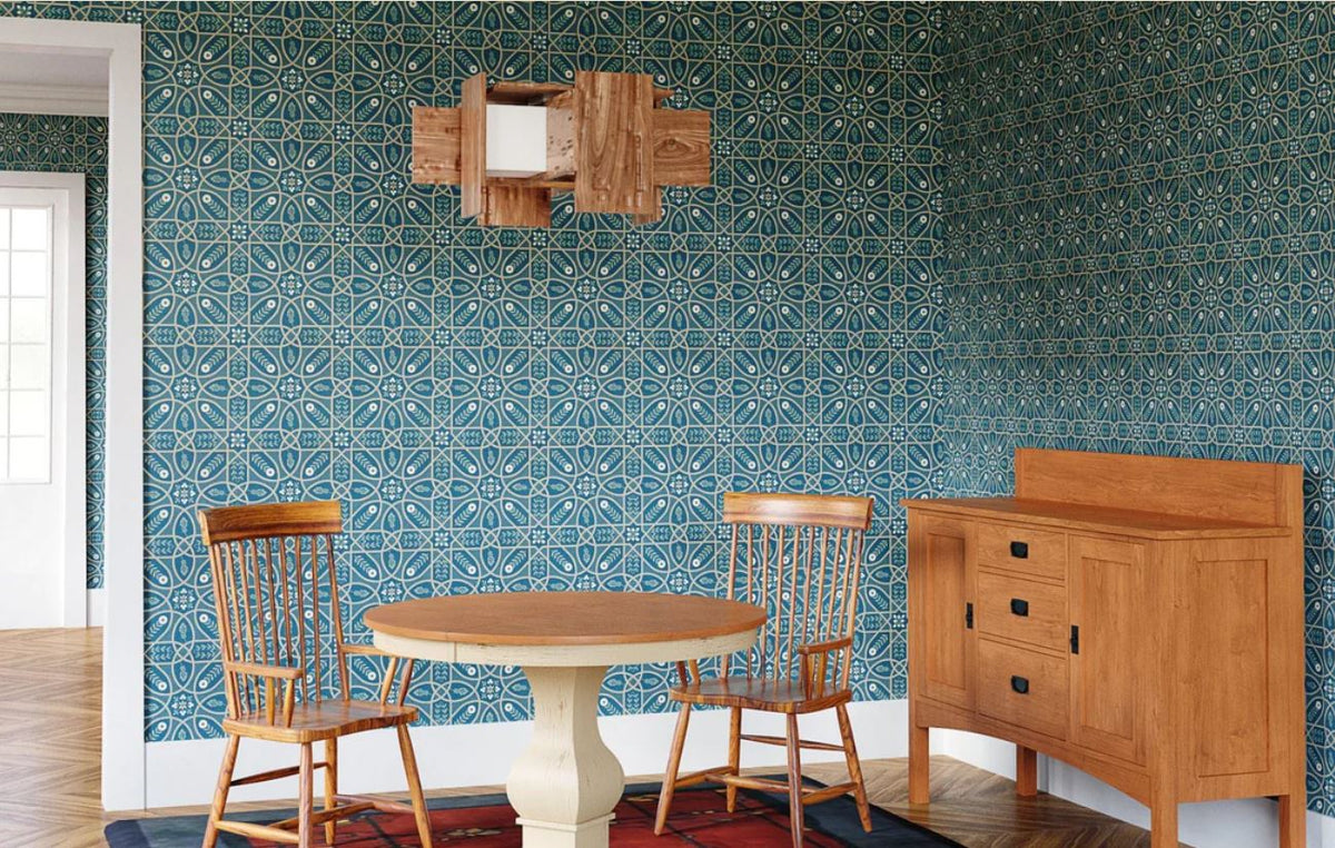Muto walnut veneer pendant chandelier hanging in a dining room with blue patterned wallpaper.