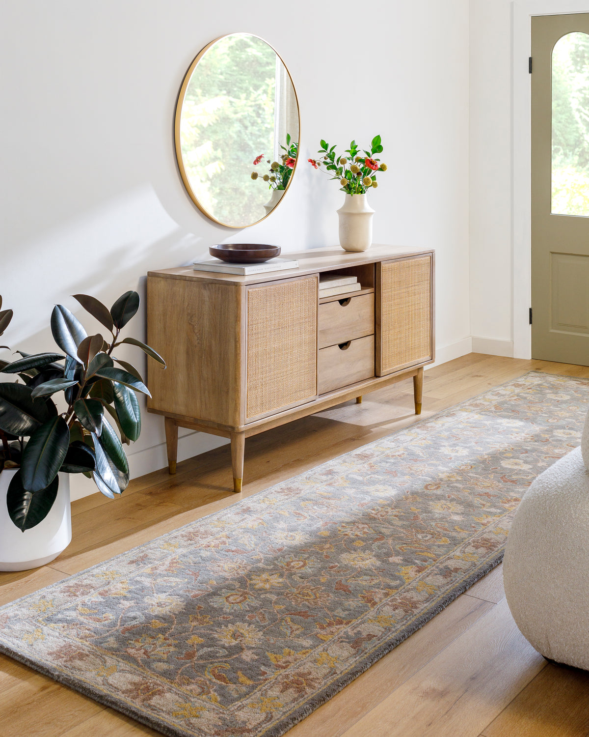 Nobility Flint hand-tufted wool runner rug in charcoal, mustard, and grey in a modern hallway.
