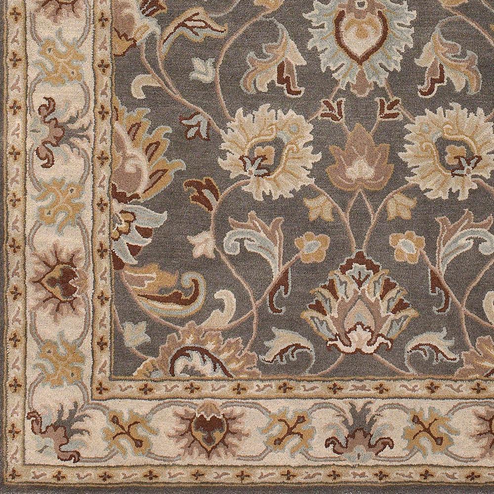 Nobility Flint hand-tufted wool rug with charcoal field and floral patterns in mustard, taupe, and grey.