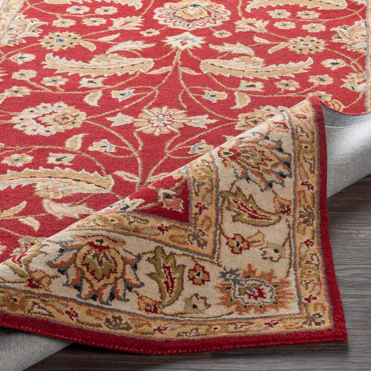 Lucia Cinnamon hand-tufted wool rug with a deep red and beige floral design.
