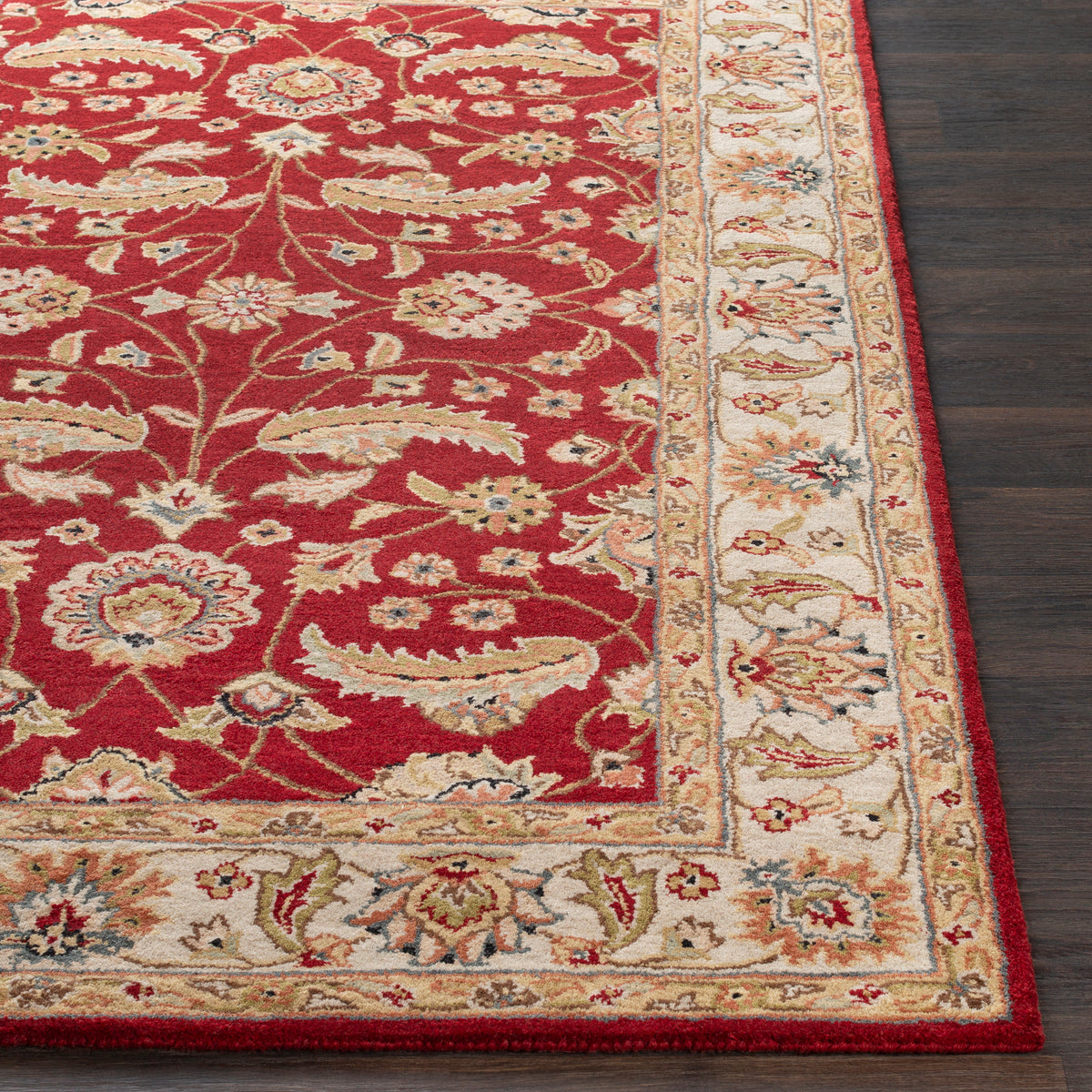 Lucia Cinnamon hand-tufted wool rug with a red floral pattern and cream border