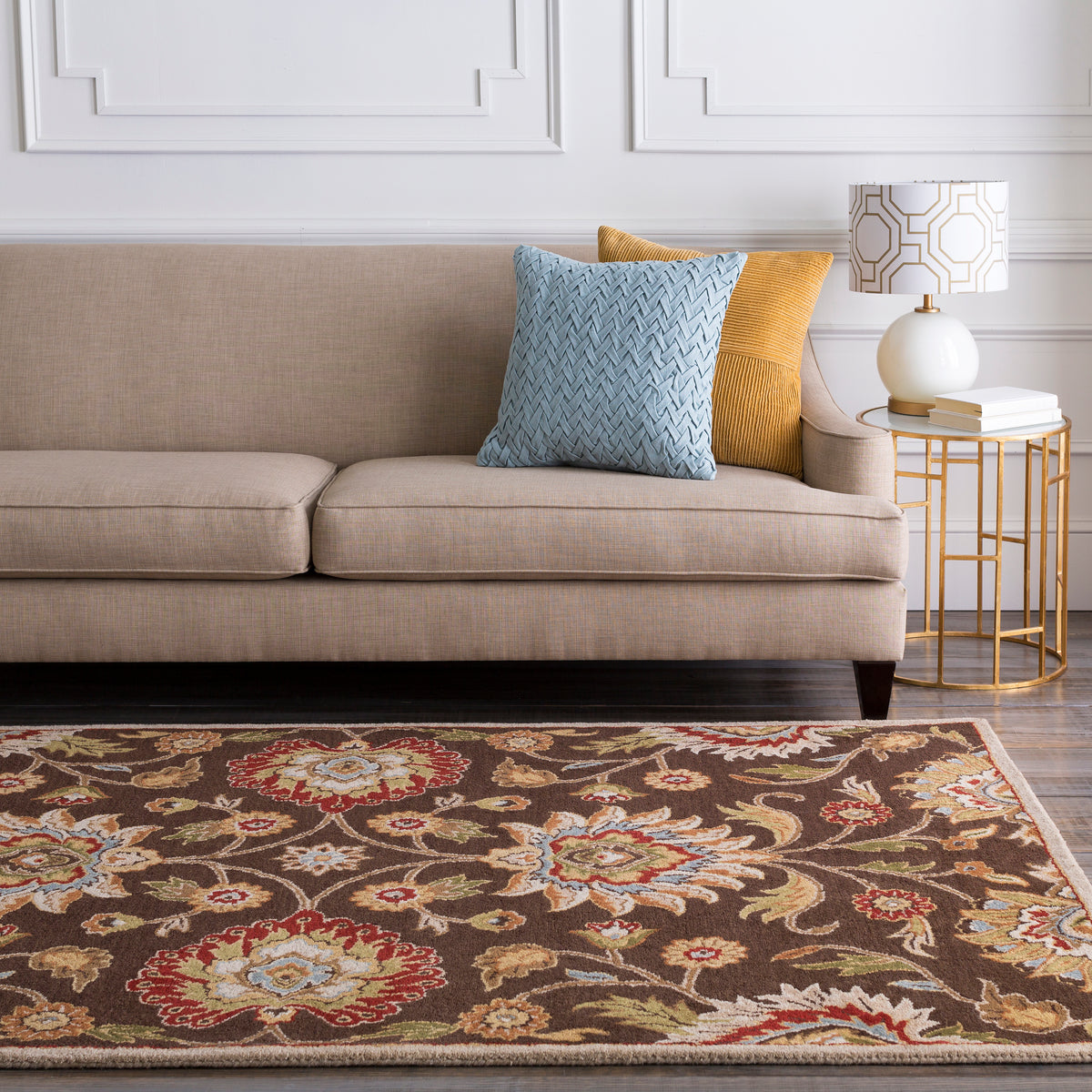 Mediterranean Umber hand-tufted wool rug with a brown floral pattern in a living room.