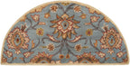 Half-round blue wool rug with a classic floral pattern in beige and brown.