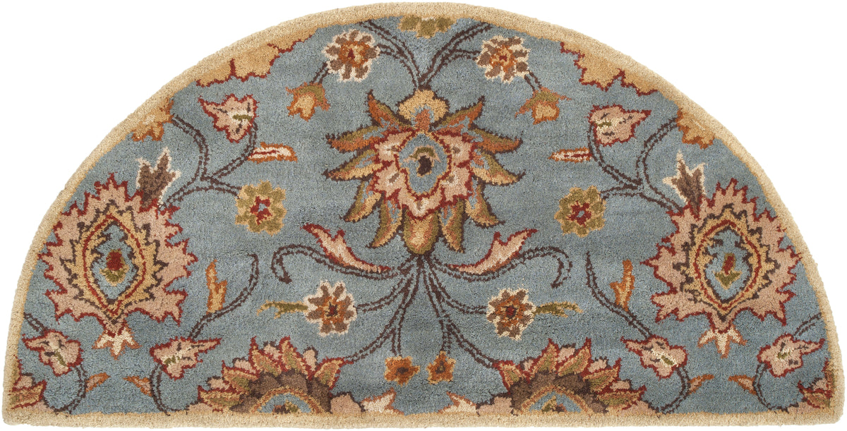 Half-round blue wool rug with a classic floral pattern in beige and brown.