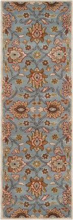 Mediterranean Cerulean hand-tufted wool runner rug with a classic floral pattern in blue, beige, and rust.
