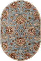 Oval Mediterranean cerulean blue wool rug with a hand-tufted floral pattern.