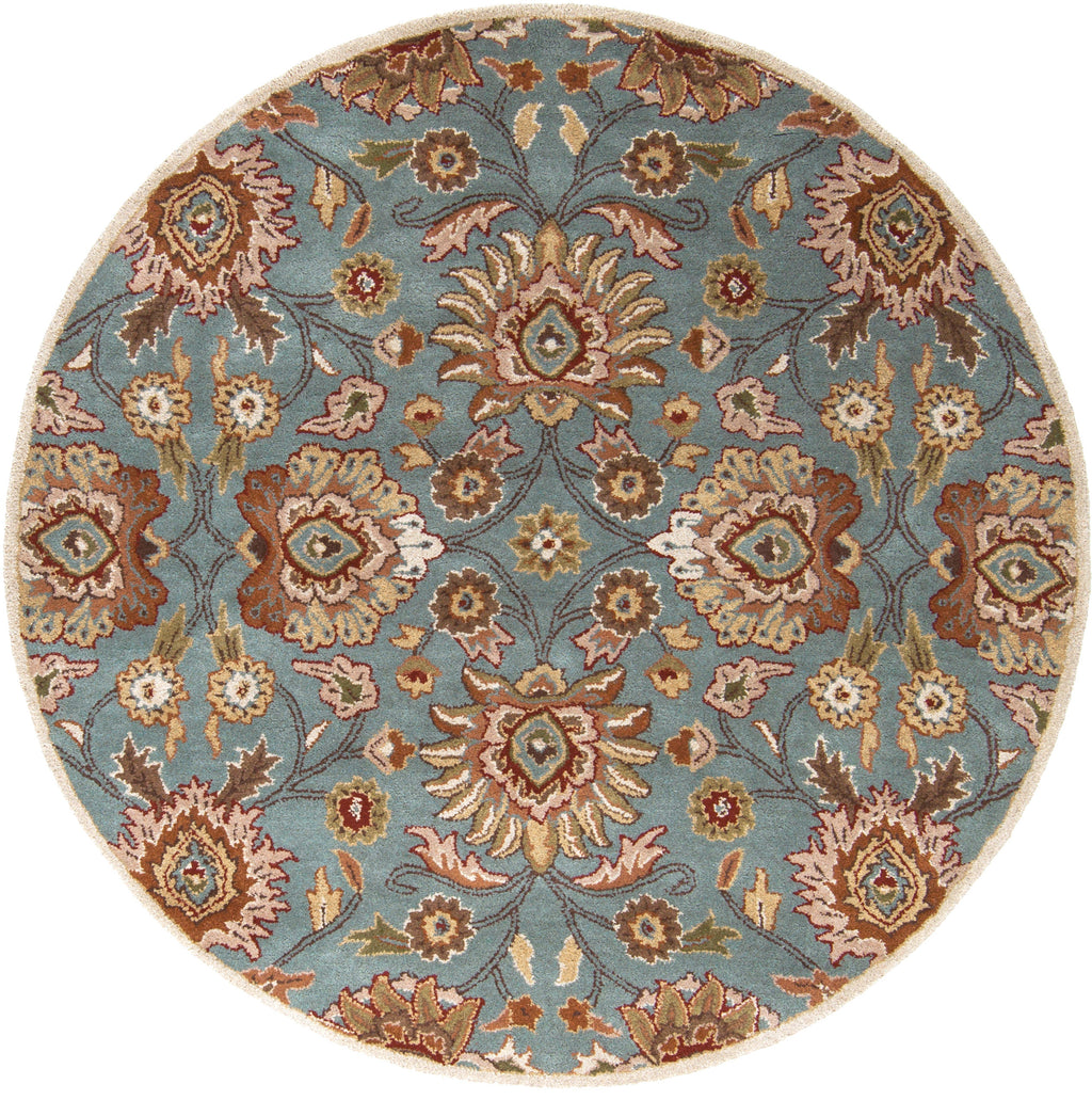 Round blue hand-tufted wool rug with a classic floral pattern in brown and beige.