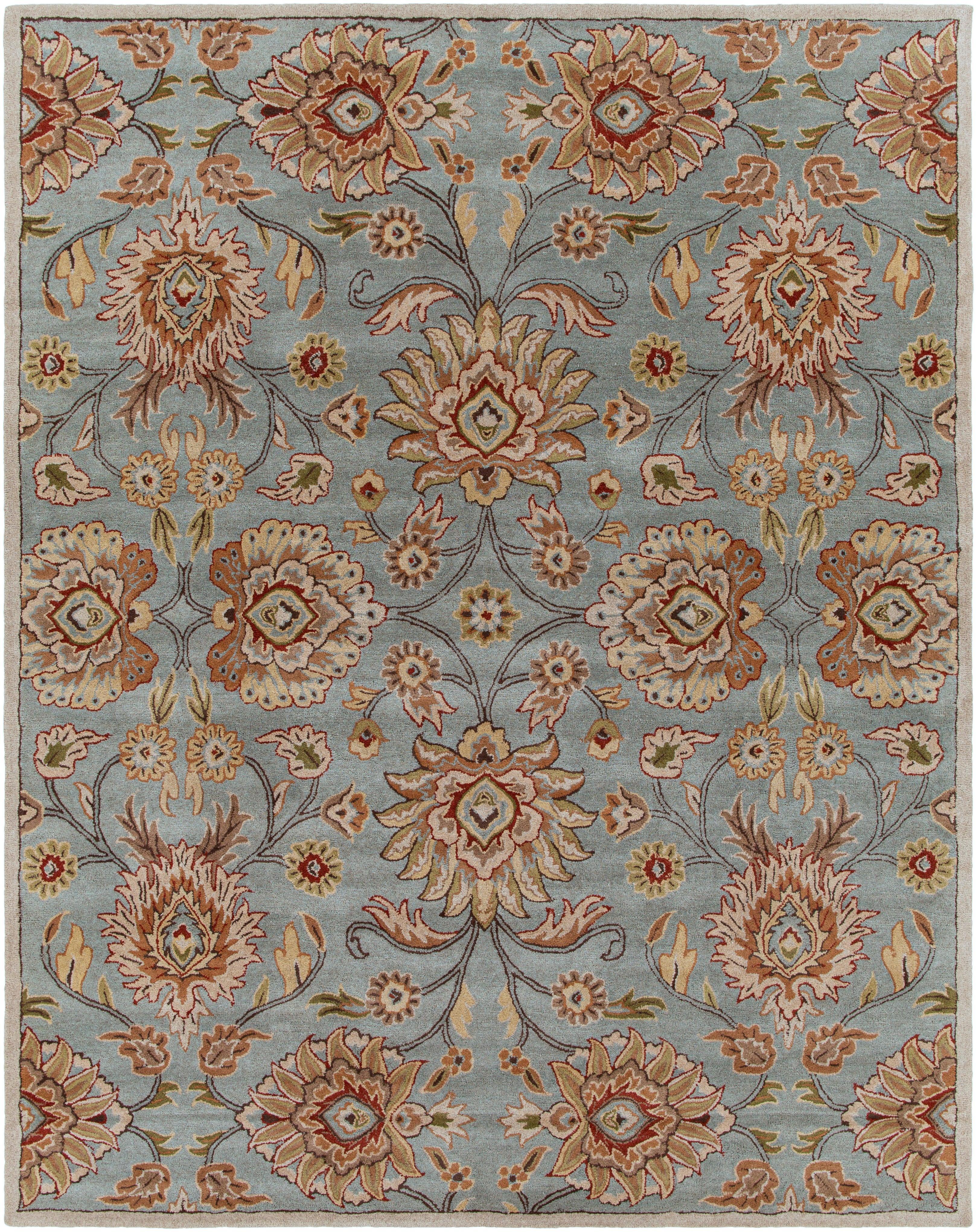 Mediterranean Cerulean hand-tufted wool rug with a classic floral pattern in blue, beige, and rust.