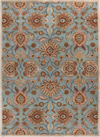 Mediterranean Cerulean hand-tufted wool rug with a blue background and beige floral pattern.