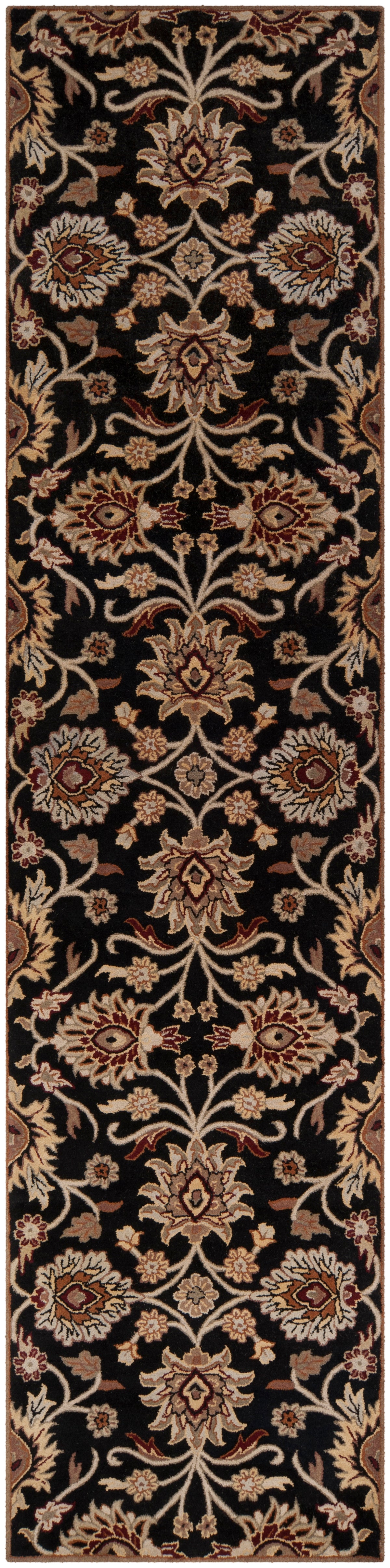 Mediterranean Ink hand-tufted wool runner rug with floral patterns on a black background.