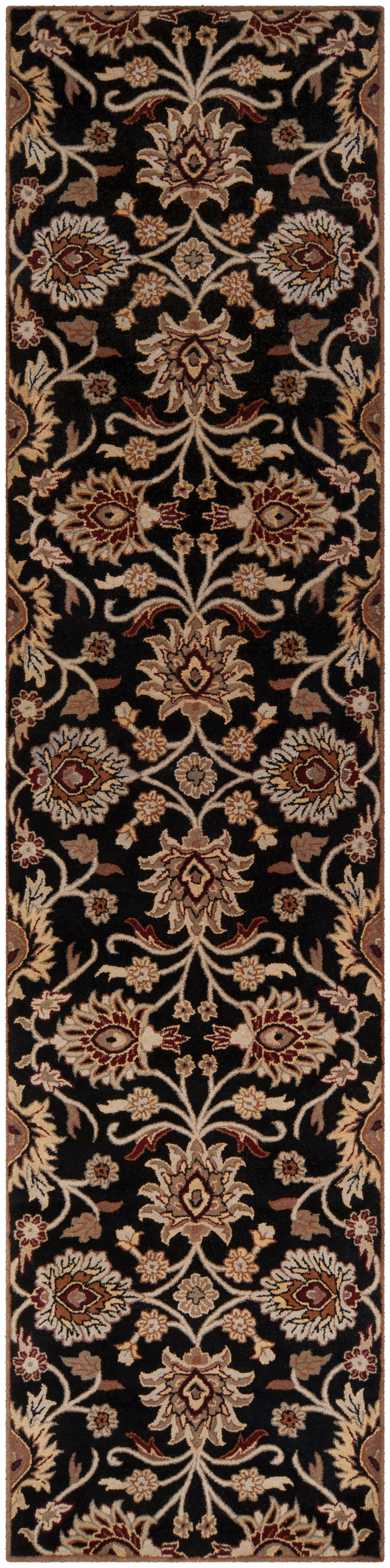 Mediterranean Ink hand-tufted wool runner rug with floral patterns on a black background.