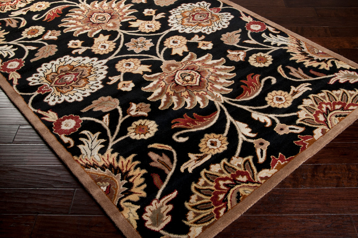 Mediterranean Ink hand-tufted wool rug with floral patterns on a black background.
