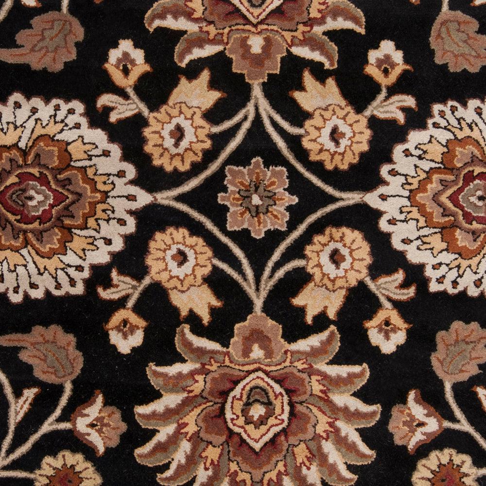 Mediterranean Ink hand-tufted wool rug with floral patterns on a black background.