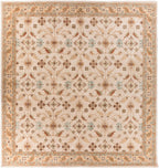 Carthage Beige hand-tufted wool rug with a traditional floral pattern and border.