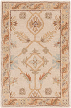 Carthage Beige hand-tufted wool rug with traditional floral patterns and neutral tones.