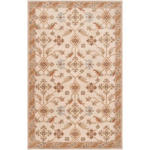 Carthage Beige hand-tufted wool rug with traditional floral motifs and border.