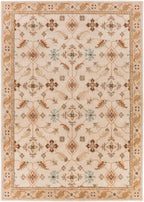 Carthage Beige hand-tufted wool rug with traditional floral patterns.