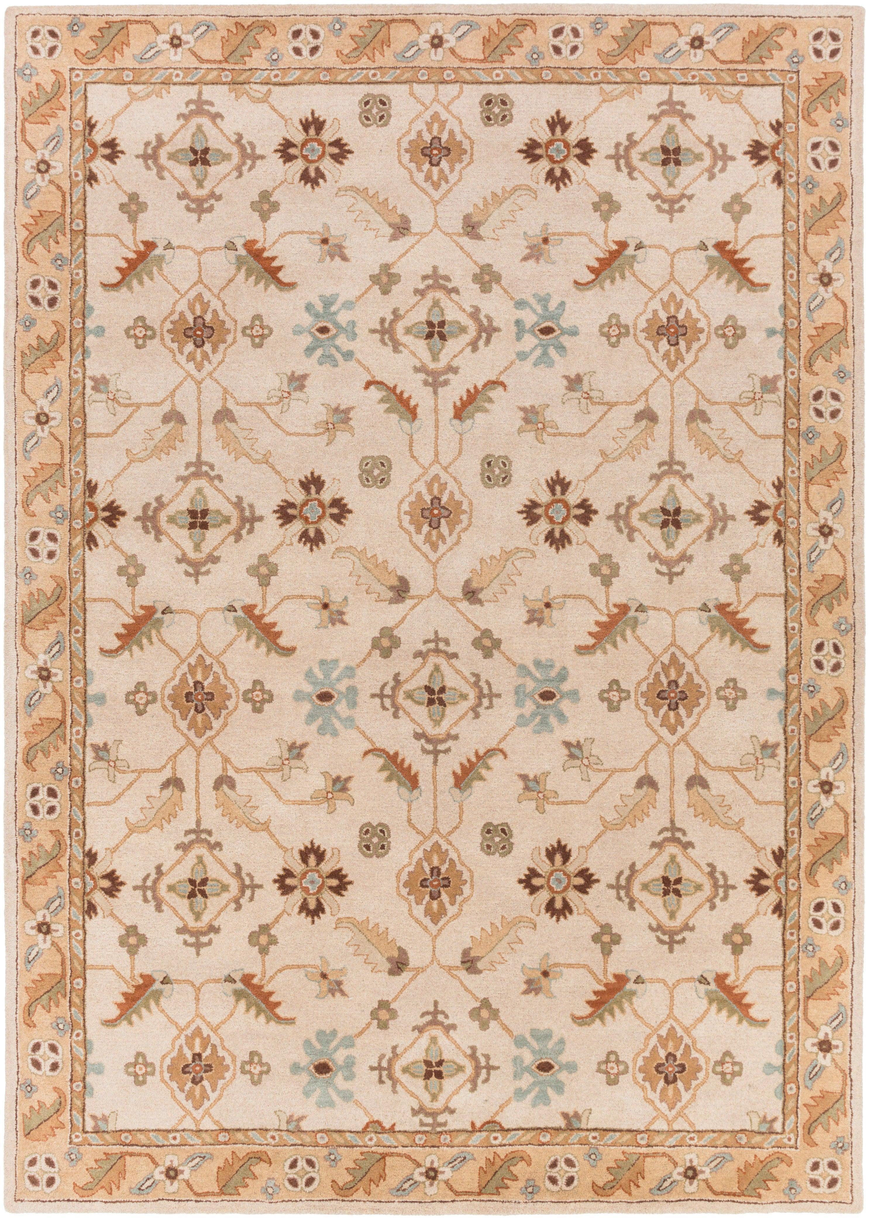 Carthage Beige hand-tufted wool rug with traditional floral patterns.