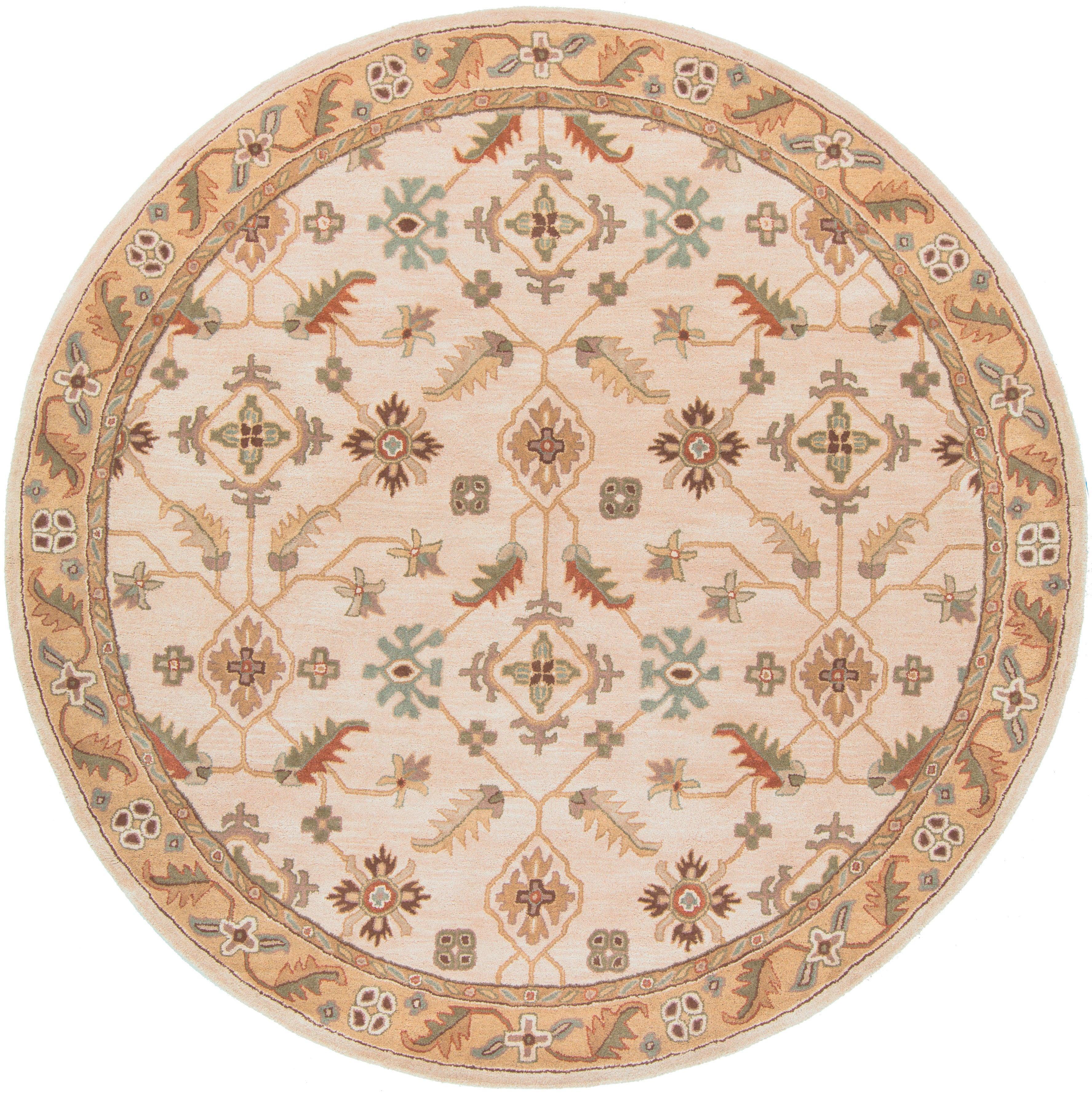 Round Carthage Beige hand-tufted wool rug with traditional floral patterns.