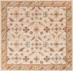 Carthage beige hand-tufted wool rug with traditional floral patterns and borders.