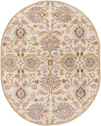 Oval hand-tufted wool rug with a beige background and lilac floral patterns.