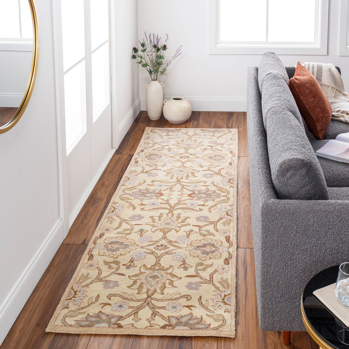 Mediterranean Lilac hand-tufted wool runner rug with floral patterns on hardwood floor.