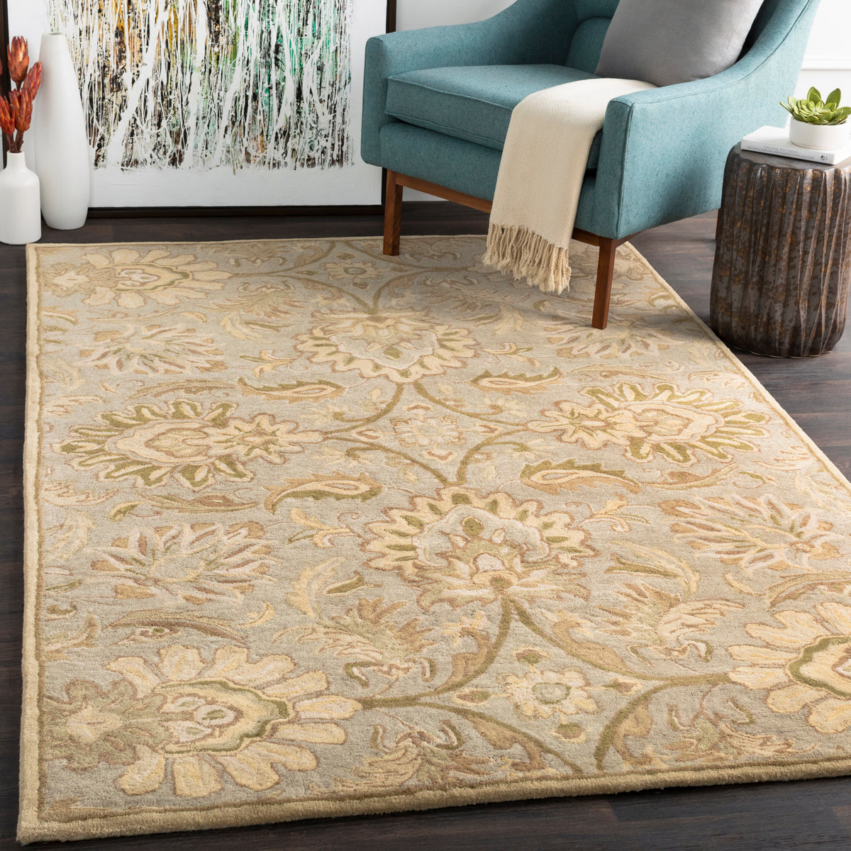 Mediterranean Sky hand-tufted wool rug with sage, gray, and ivory floral patterns in a living room.