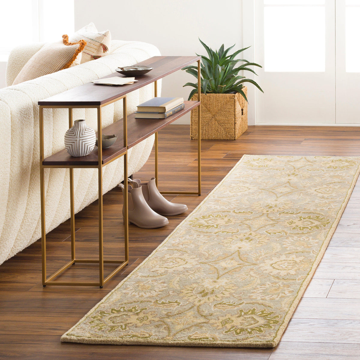 Mediterranean Sky wool runner rug with sage, gray, and ivory floral patterns on wood floor.