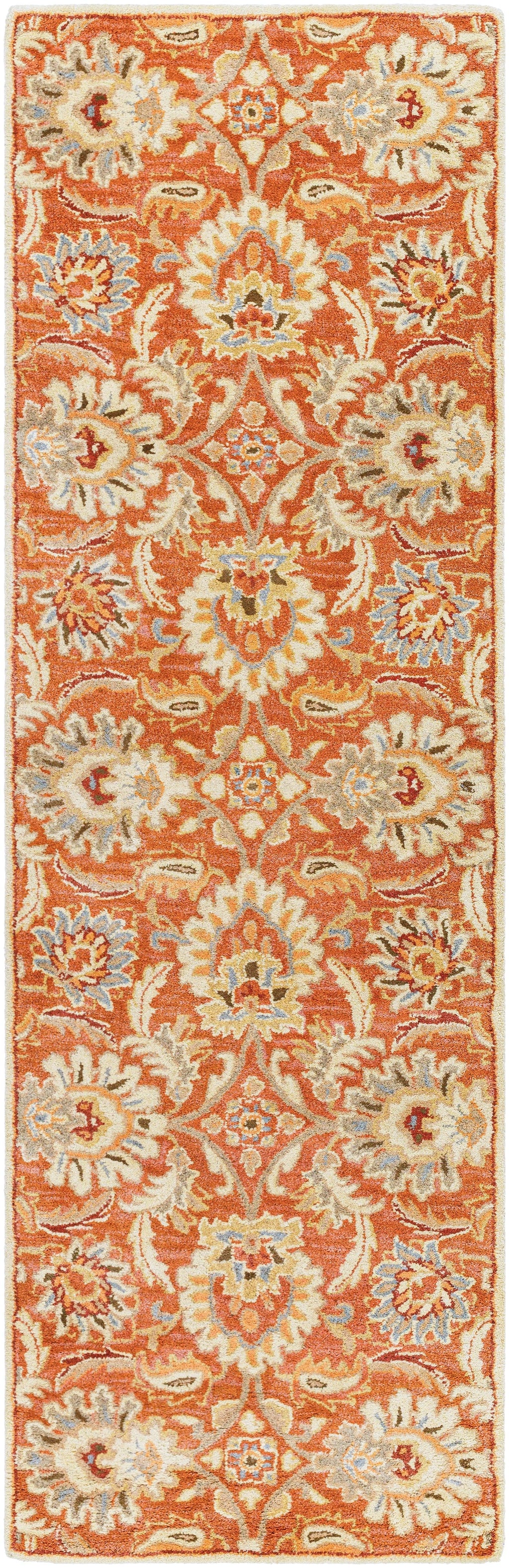 Mediterranean Cider hand-tufted wool runner rug with burnt orange floral patterns.