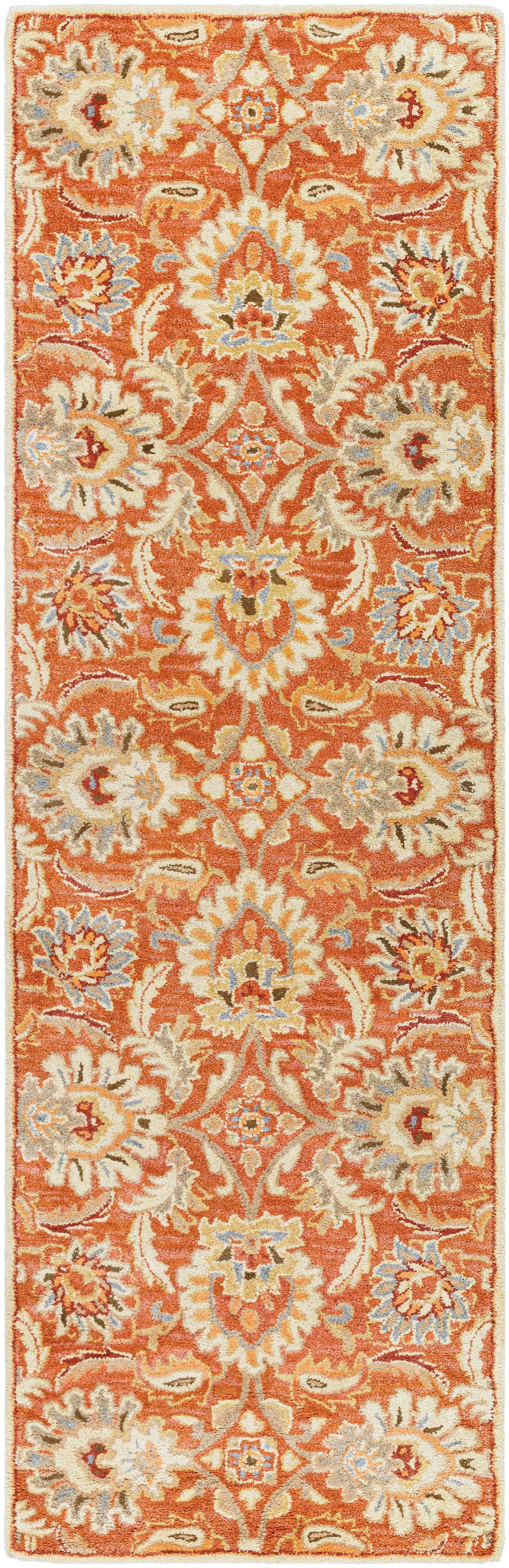 Mediterranean Cider hand-tufted wool runner rug with burnt orange floral patterns.