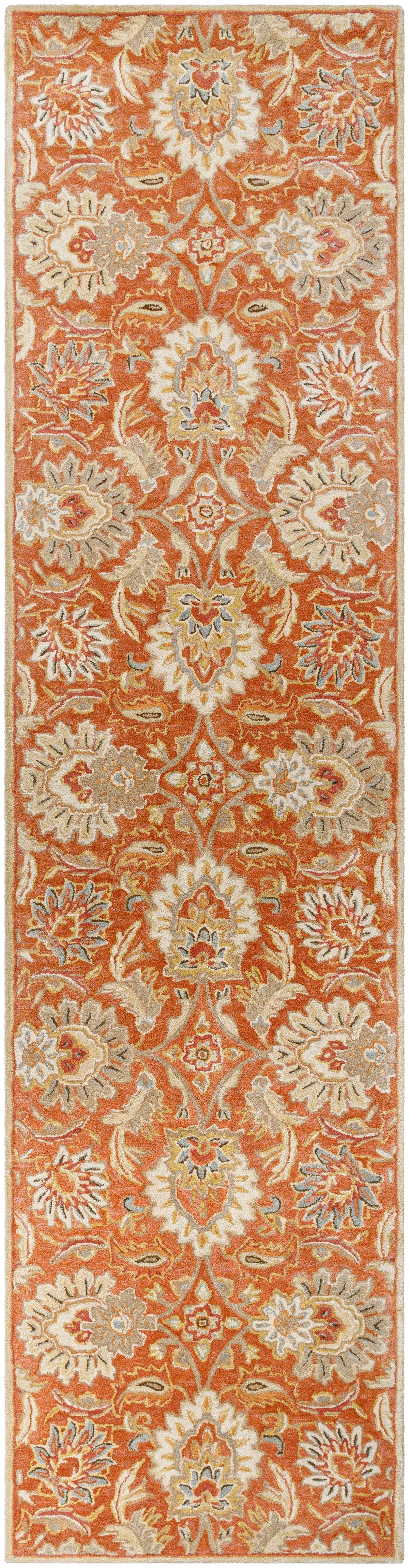 Mediterranean Cider hand-tufted wool runner rug with orange and beige floral patterns.