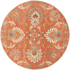 Round burnt orange Mediterranean Cider hand-tufted wool rug with floral patterns