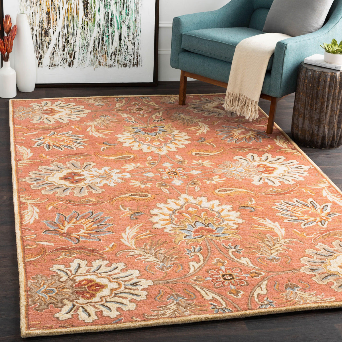 Mediterranean Cider hand-tufted wool rug with burnt orange floral patterns in a living room.