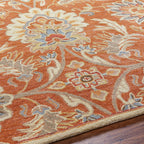 Mediterranean Cider hand-tufted wool rug with burnt orange floral patterns